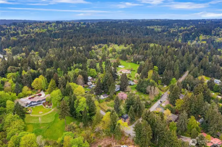 An aerial perspective showcases the remarkable privacy, scale and estate-like setting of this exceptional property.