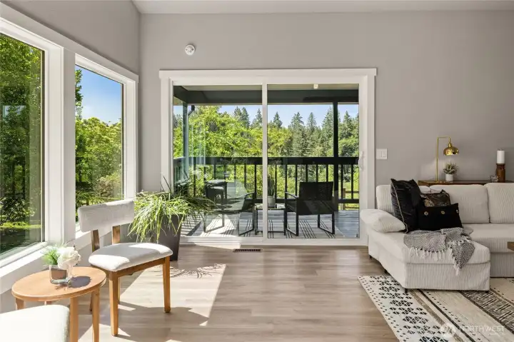 Great room with slider to back covered deck with views for days!  Mt. Rainier and Lake Moneysmith, pasture and more!