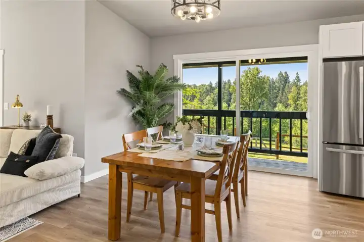 Dining area with oversized slider to back deck area!