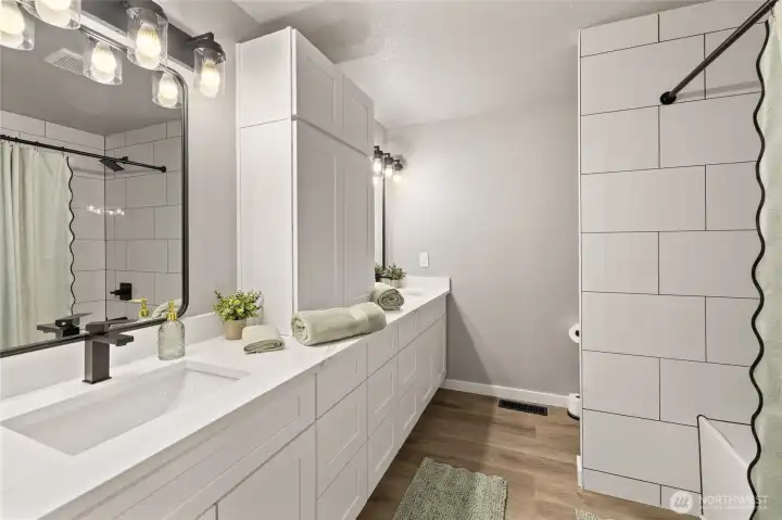 2nd Full bathroom with dual sinks, new cabinets, tile, bath/shower, flooring and more!  Storage galore too!