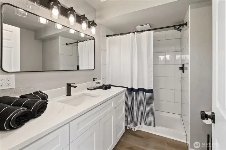 3/4 bath with access to bedroom and barn door access to living room area!