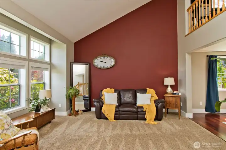 Natural light pours into the front room through large windows, while newly installed blinds add a modern touch and privacy Natural light pours into the front room through large windows, while newly installed blinds add a modern touch and privacy