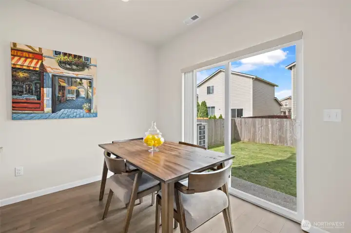 Dining area leads out to sizable fenced back yard. Dining area leads out to sizable fenced back yard.