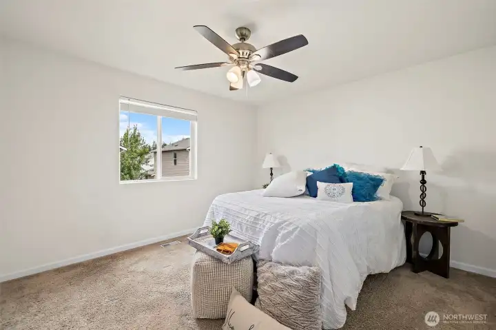 Spacious primary bedroom with adjoining bathroom. Spacious primary bedroom with adjoining bathroom.