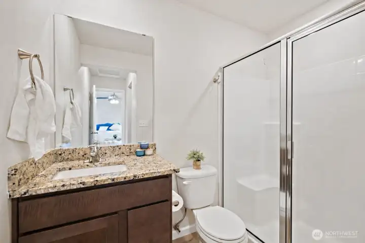 Neutral step-in shower upstairs. Neutral step-in shower upstairs.
