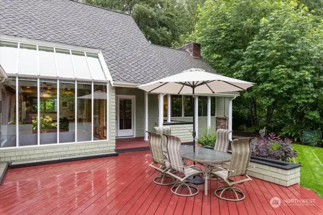 Entertainment size Deck. Nice Covered area also by the French Doors. Notice the Skywall window from the Dining Area.