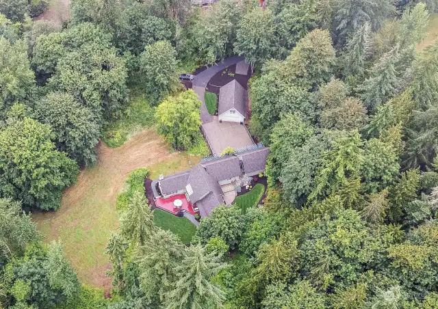 Shy 5 Acre Estate. Showing the home with the Detached Garage/Shop with Living quarters.