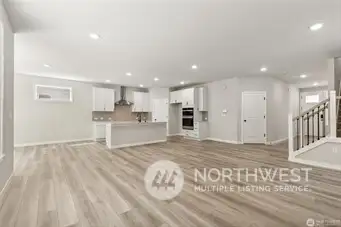 Great Room - Disclaimer Secondary photos of same floor plan on different lot in different community: Photos are from another Warren, finishes, upgrades, and features may vary.