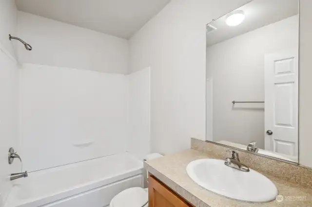 Guest bathroom with bathtub