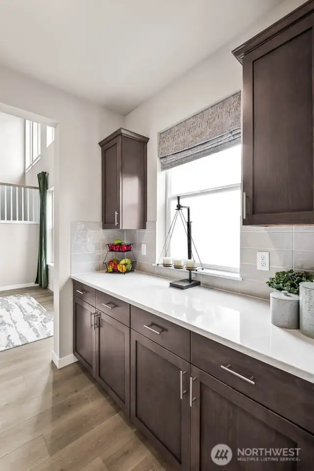 Butler's Pantry connects Kitchen & Dining. Across is a large walk-in pantry (not shown). Photos are for representational purposes only.  Colors and options may vary.