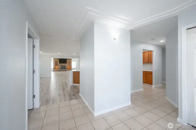 From the Entry a view toward the Kitchen and hall to bedrooms