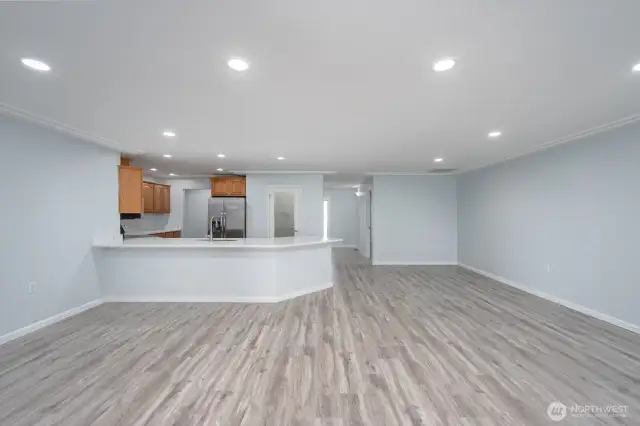 A view of the Kitchen and the Family and Dining Room