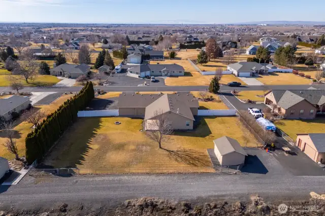 A view of the fenced backyard. Note the easy-access RV parking space.