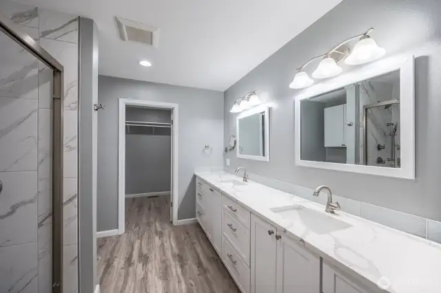 UPDATED AND GORGEOUS! The two faucet heads pull out to swivel and clean the sink, a unique feature for a bathroom!