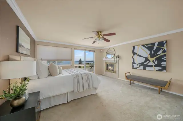 Spacious Primary Bedroom with sliders to viewing deck and fireplace