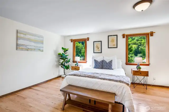 Primary bedroom (more beautiful hardwood flooring)