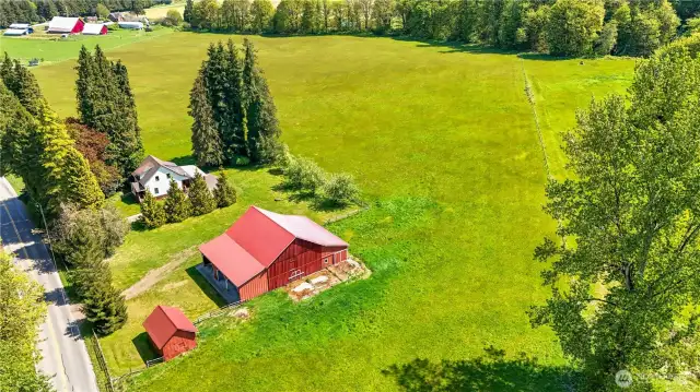 The home and outbuildings are located on a 20+ acre piece.  With the AG10 zoning it may be possible to create another building lot.  Buyer to verify.