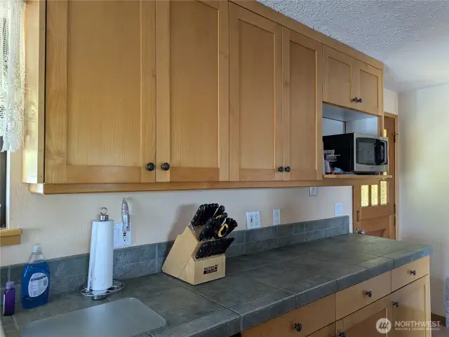 new cabinets and tile countertops