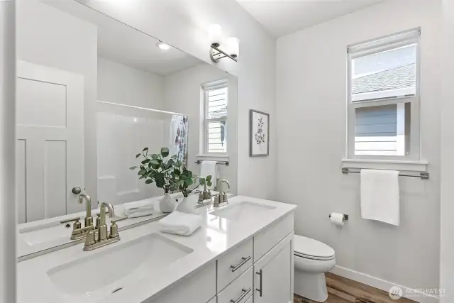 Full bathroom located near the front of the home and near two spacious bedrooms.