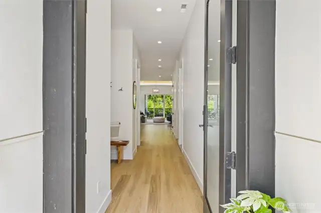 Imagine arriving home each day through this custom front door—where wide-plank floors, soaring 10’ ceilings, and curated design details welcome you in with effortless elegance.