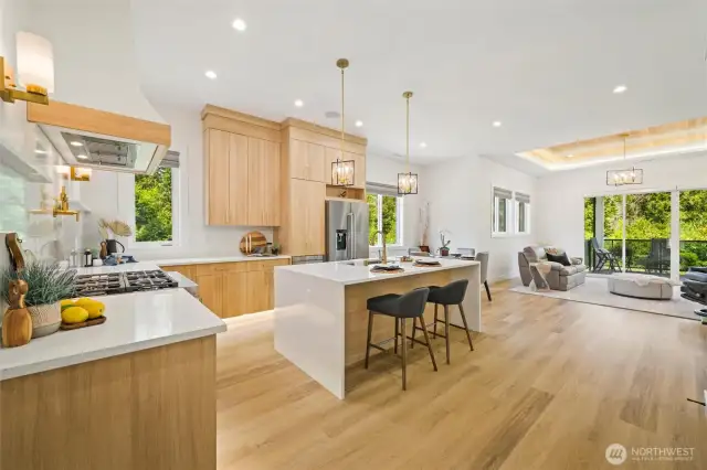 Step into the heart of the home—where a commercial-grade range, pot filler, and quartz counters invite you to cook, create, and gather in style. This kitchen isn't just functional—it's unforgettable. The waterfall island finish and slab quartz back splash really set the stage for a luxe experience.