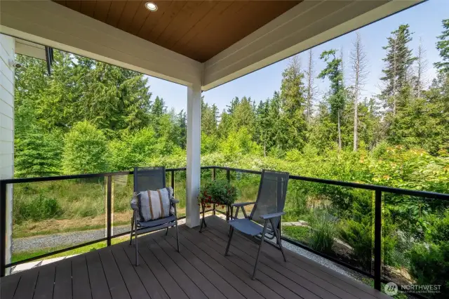 Covered outdoor living with tranquil green views—your private haven for morning coffee, alfresco dinners, or resort-style relaxation.