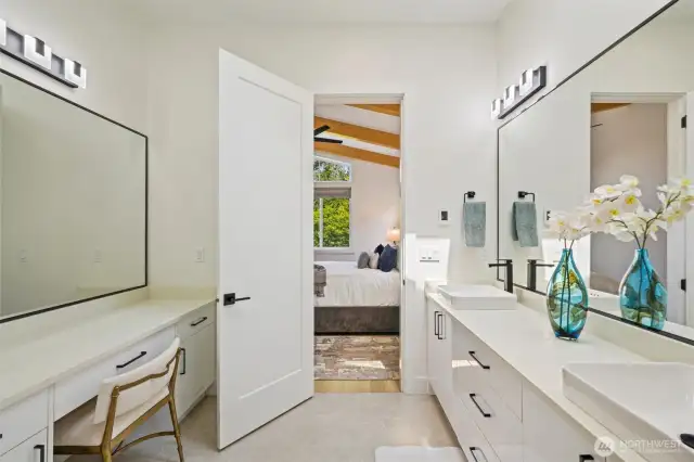 Escape to your vaulted primary suite—spa-inspired bath with heated floors offers impeccable comfort and a serene seaside retreat every day. Double sinks and a full vanity.