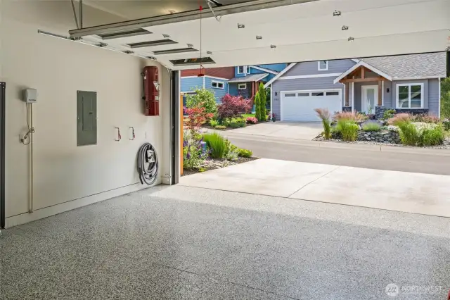 Smart luxury extends to the epoxy-finished garage floor: easy maintenance and sleek style make every corner of this home feel polished and purposeful.