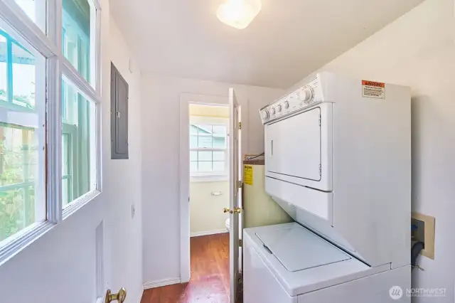 Laundry / mudroom off kitchen with a half bath beyond.