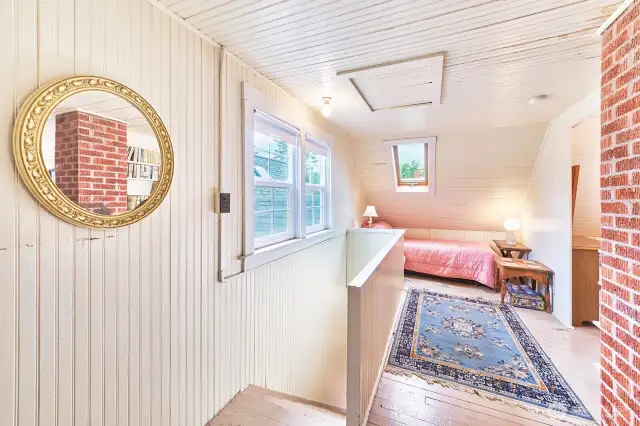 Upstairs is one big room divided into separate sleeping areas.