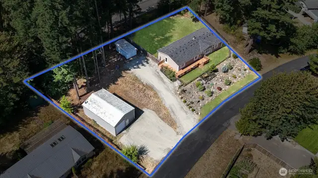 Enjoy plenty of room for hosting events or just enjoying the scenery. Lawn has been edited for photography pursposes.  Blue boundary lines are approximate. Buyer to verify to own satisfaction.