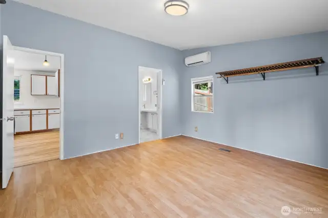 The primary bedroom is ready to be your retreat with private bathroom, mini split and more views of the evergreens.