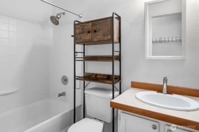 The main bathroom includes a shower, tub, and thoughtful updates.
