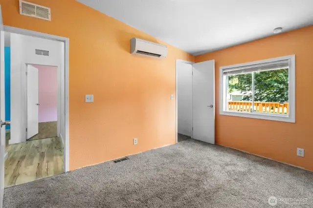 The 3rd bedroom is carpeted, and also features a mini split and walk in closet.