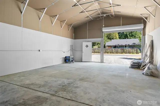 The shop features 220 electric, concrete flooring, vaulted ceilings and even the generator is included in the sale!