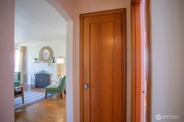 Hall closet with original door and vintage hardware