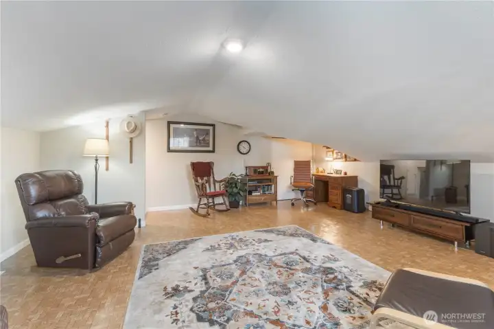 Very large storage closet in corner by desk.