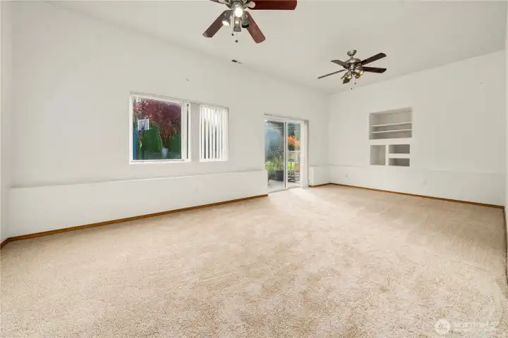 Spacious family room seamlessly connecting to a delightful backyard oasis.