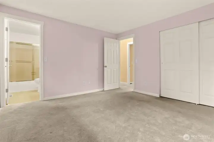 Primary bedroom including ensuite with full tub and shower