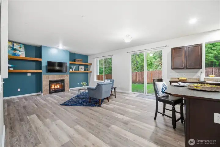 Grand room with fireplace and built in wall