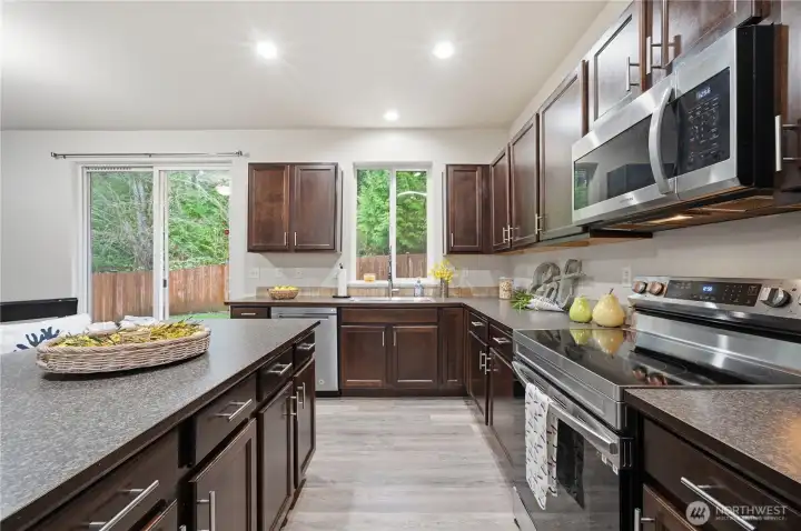 Spacious kitchen that looks out back with large island