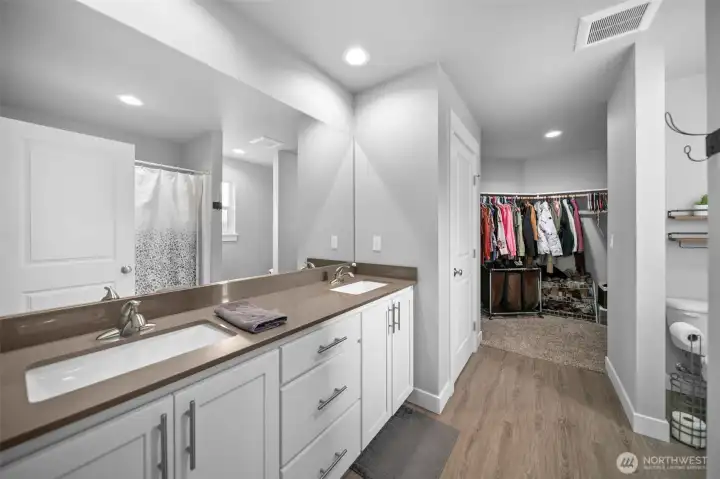 Primary bathroom and walk-in closet.