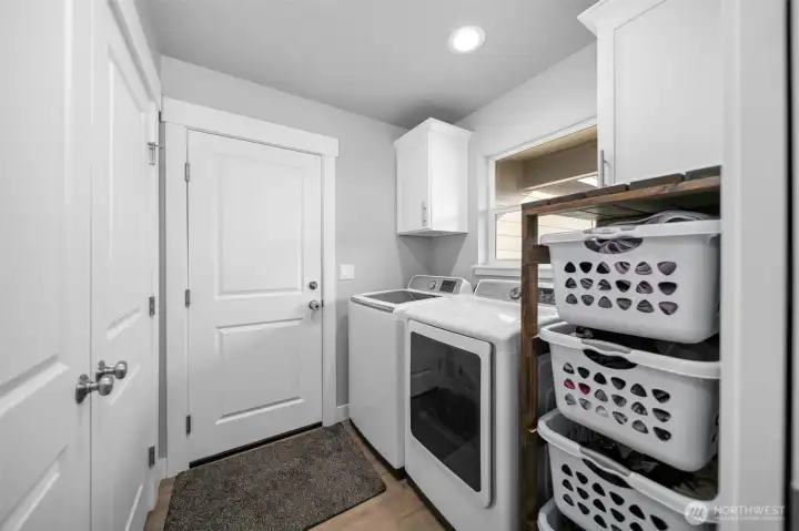 Laundry room with access to the garage.