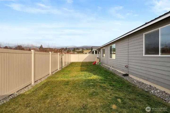 Low maintenance, fully fenced backyard.