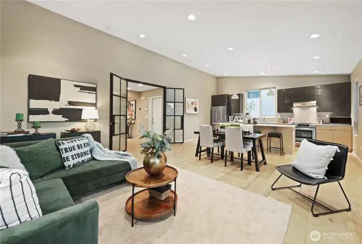 Through the wrought iron, custom, French doors you enter into a the great-room featuring living room, dining room and kitchen worthy of the chef!