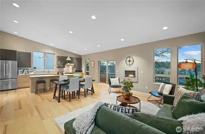Looking to the right of the kitchen you can see the wall of western windows providing warm light and a sweeping view across the valley below.