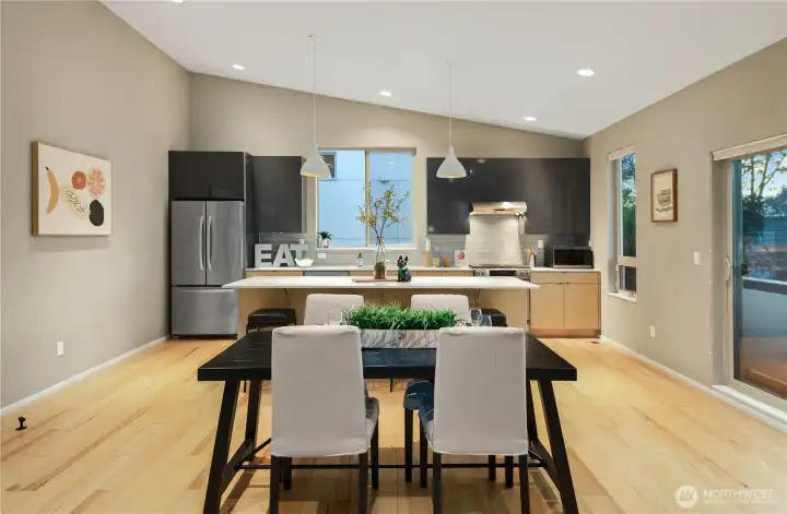 The dining room is at hand to the kitchen so that the chef may join in lively dinner conversation while keeping watch in the kitchen. One can prepare a delicious meal for guests without missing a minute of the evening's fun.