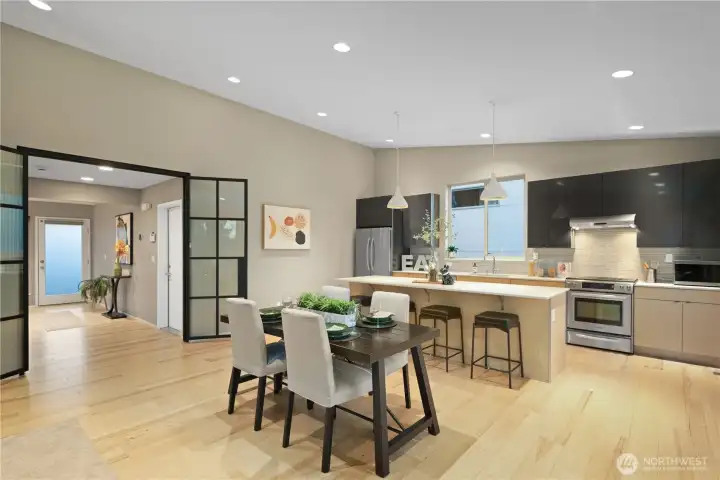 This dining room photo shows the gracious feel of the place. The kitchen island makes a wonderful buffet area for side dishes or pre-dinner appetizers. Everyone enjoys visiting with the chef as the dinner comes together and the bar stools let guests visit & relax while watching the chef. The kitchen island also makes a perfect breakfast bar for morning coffee and danish in an informal setting.