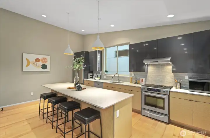 Clean lines, stainless appliances  and custom cabinetry make this kitchen a work of art.