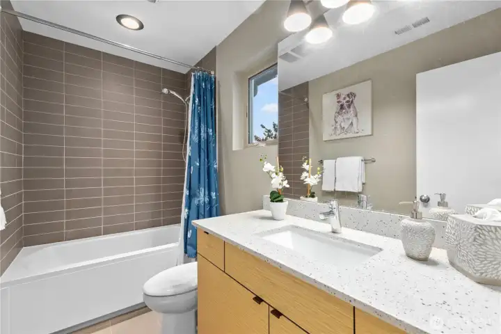 This photo shows the beautiful finishes in the guest bath. This will be a lovely, full bath with a tub/shower combination for your guests.